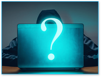 Hacker hiding behind laptop with question mark on it